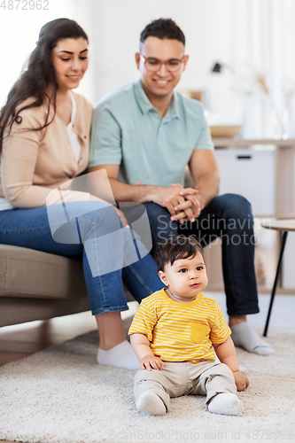 Image of happy family with child at home