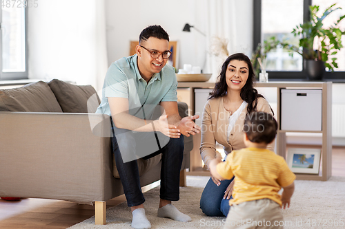 Image of happy family with child at home