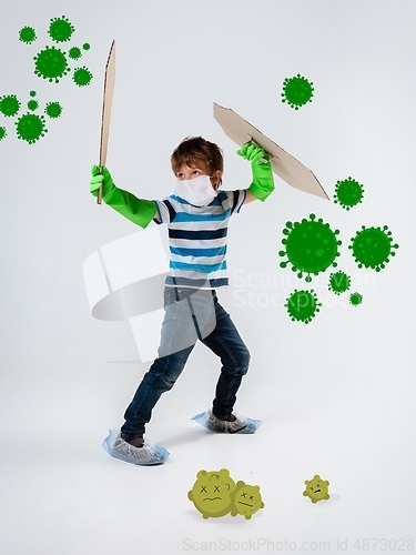 Image of Little caucasian boy as a warrior in fight with coronavirus pandemic, bright design with cute and funny cartoons style drawings