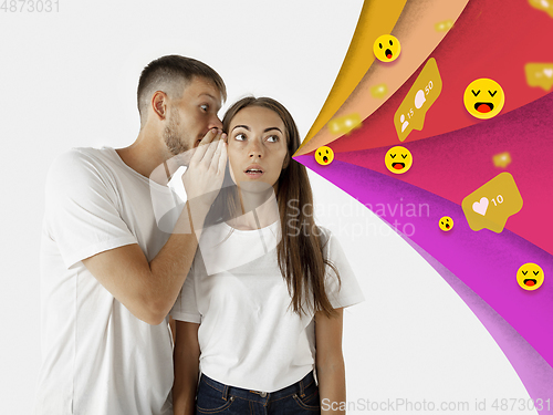 Image of Colorful drawing in cartoon style collaged with portrait of young caucasian couple with waves of likes, emotions, social network icons