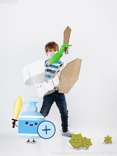 Image of Little caucasian boy as a warrior in fight with coronavirus pandemic, bright design with cute and funny cartoons style drawings