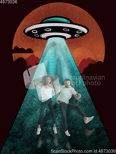 Image of Colorful drawing in cartoon style collaged with portrait of young caucasian couple being stolen by UFO