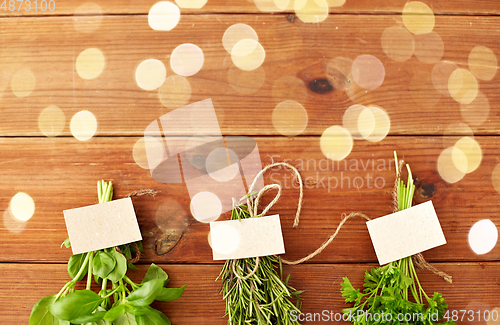 Image of greens, spices or medicinal herbs on wooden boards