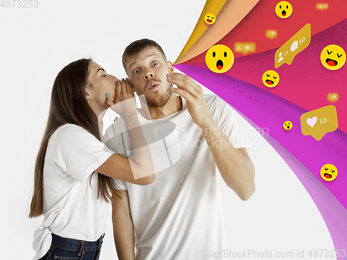 Image of Colorful drawing in cartoon style collaged with portrait of young caucasian couple with waves of likes, emotions, social network icons