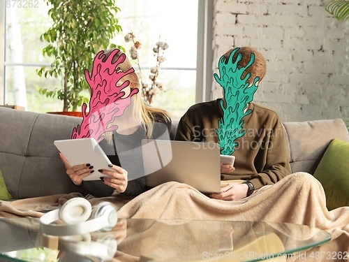 Image of Colorful drawing in cartoon style collaged with portrait of young caucasian couple with splashes from out their devices, information flow