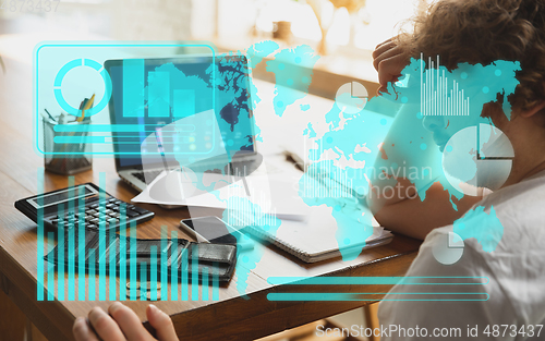 Image of Interface modern technology and digital layer effect. Man counting, working in despair, went bankrupt. Business, finance crisis, economics recession, unemployment concept.