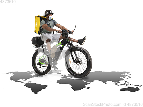 Image of Home delivery, food purchase via the Internet. Deliveryman on bike arriving to any address worldwide on the map with your order.