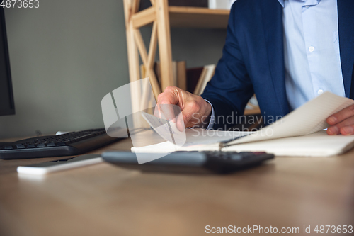 Image of Young man, manager, team led return to work in his office after quarantine, feels happy and inspired