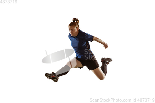 Image of Female soccer, football player kicking ball, training in action and motion with bright emotions isolated on white background