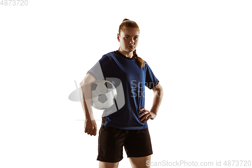 Image of Female soccer, football player posing confident with ball isolated on white background