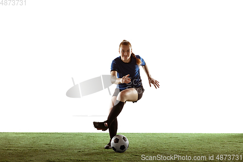 Image of Female soccer, football player kicking ball, training in action and motion with bright emotions isolated on white background