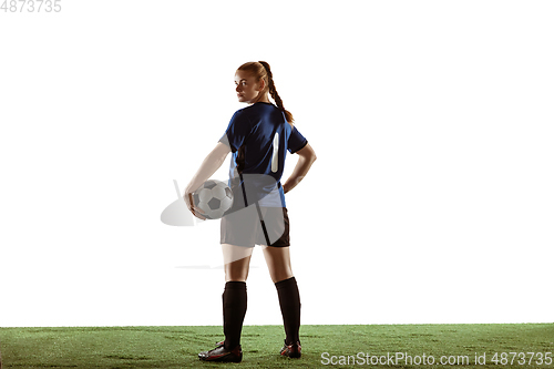 Image of Female soccer, football player posing confident with ball isolated on white background