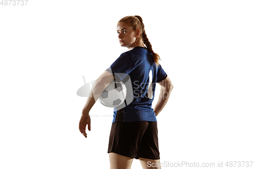 Image of Female soccer, football player posing confident with ball isolated on white background