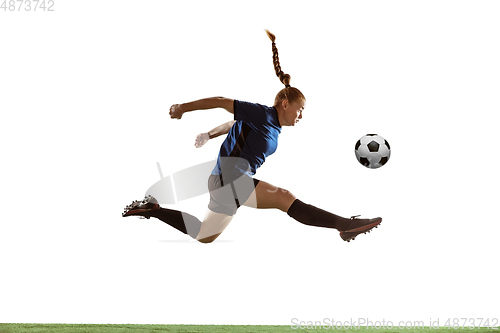 Image of Female soccer, football player kicking ball, training in action and motion with bright emotions isolated on white background