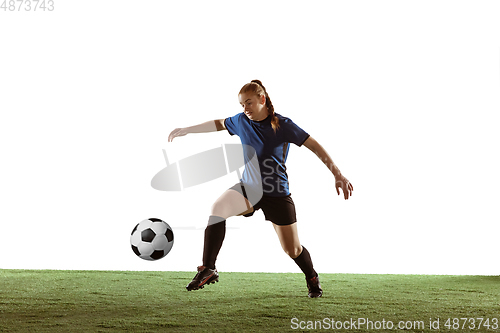 Image of Female soccer, football player kicking ball, training in action and motion with bright emotions isolated on white background