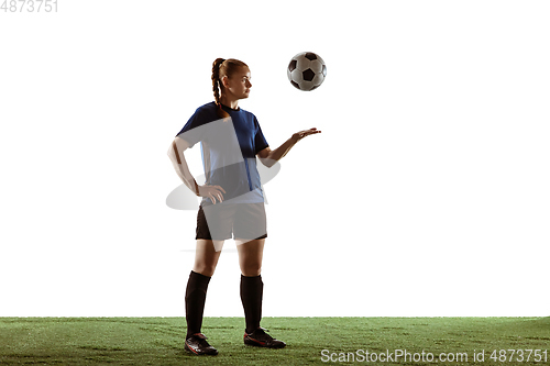 Image of Female soccer, football player posing confident with ball isolated on white background