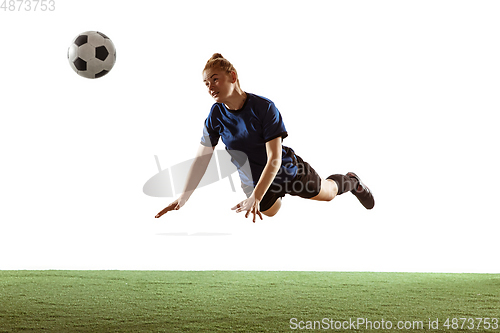 Image of Female soccer, football player kicking ball, training in action and motion with bright emotions isolated on white background