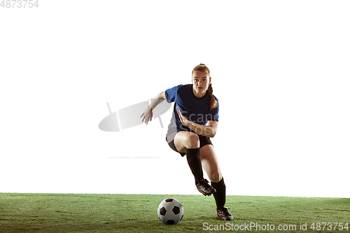 Image of Female soccer, football player kicking ball, training in action and motion with bright emotions isolated on white background