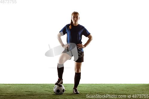 Image of Female soccer, football player posing confident with ball isolated on white background