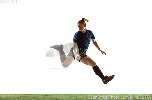 Image of Female soccer, football player kicking ball, training in action and motion with bright emotions isolated on white background