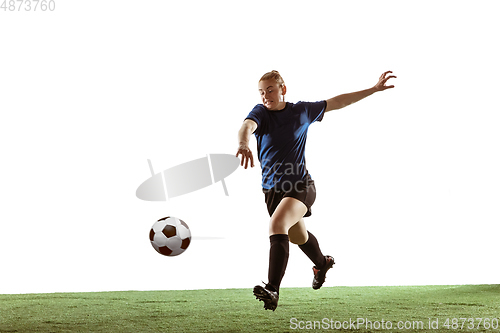 Image of Female soccer, football player kicking ball, training in action and motion with bright emotions isolated on white background