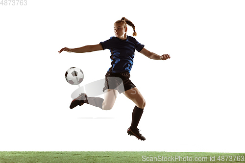 Image of Female soccer, football player kicking ball, training in action and motion with bright emotions isolated on white background