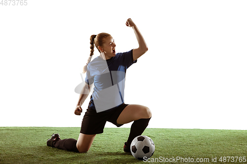 Image of Female soccer, football player celebrating goal winning with bright expressive emotions isolated on white background