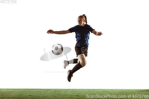 Image of Female soccer, football player kicking ball, training in action and motion with bright emotions isolated on white background