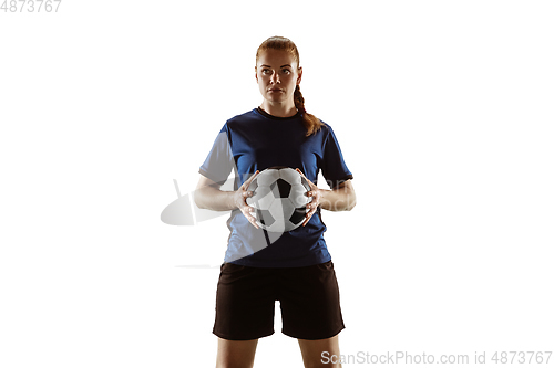 Image of Female soccer, football player posing confident with ball isolated on white background