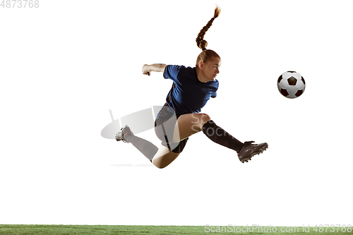 Image of Female soccer, football player kicking ball, training in action and motion with bright emotions isolated on white background