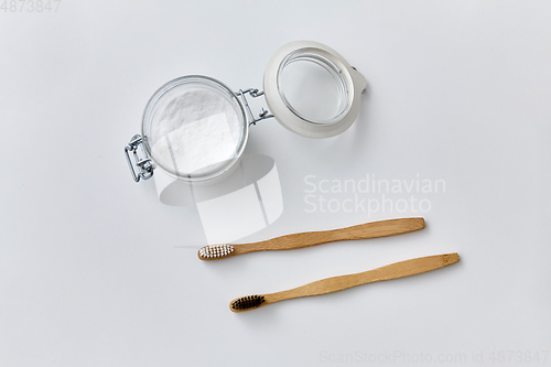 Image of washing soda and wooden toothbrushes