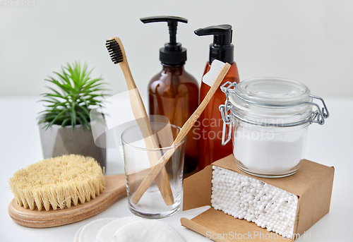 Image of wooden toothbrush, cotton pads and swabs in box