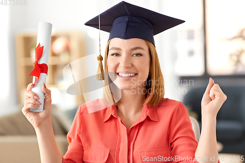 Image of student woman with laptop and diploma at home