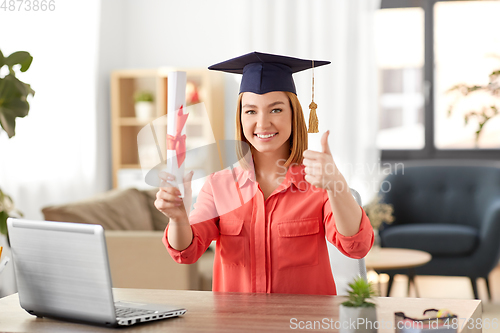 Image of student woman with laptop and diploma at home