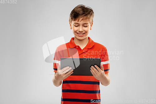 Image of happy smiling boy using tablet computer