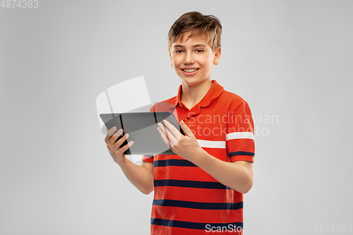 Image of happy smiling boy using tablet computer