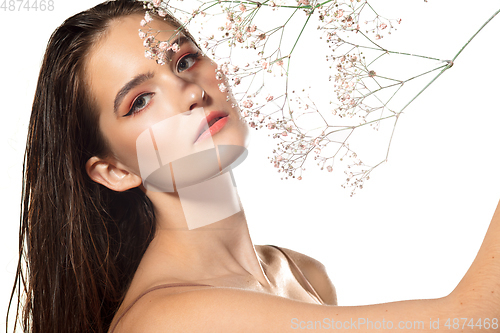 Image of Close up of beautiful female face with organic treatment over white background. Cosmetics and makeup, natural and eco treatment, skin care.