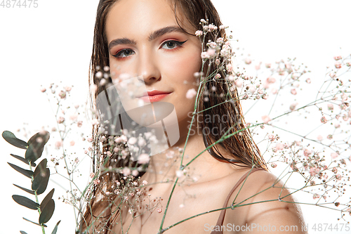 Image of Close up of beautiful female face with organic treatment over white background. Cosmetics and makeup, natural and eco treatment, skin care.