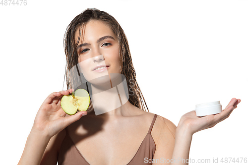 Image of Close up of beautiful female face with organic treatment over white background. Cosmetics and makeup, natural and eco treatment, skin care.