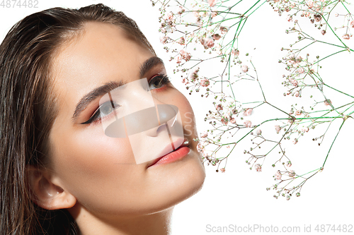 Image of Close up of beautiful female face with organic treatment over white background. Cosmetics and makeup, natural and eco treatment, skin care.