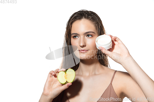 Image of Close up of beautiful female face with organic treatment over white background. Cosmetics and makeup, natural and eco treatment, skin care.