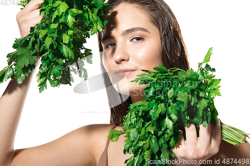 Image of Close up of beautiful female face with organic treatment over white background. Cosmetics and makeup, natural and eco treatment, skin care.