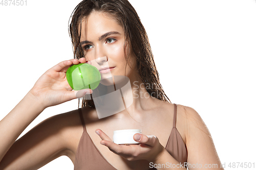 Image of Close up of beautiful female face with organic treatment over white background. Cosmetics and makeup, natural and eco treatment, skin care.