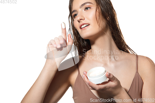 Image of Close up of beautiful female face with organic treatment over white background. Cosmetics and makeup, natural and eco treatment, skin care.