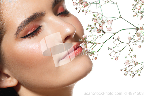 Image of Close up of beautiful female face with organic treatment over white background. Cosmetics and makeup, natural and eco treatment, skin care.