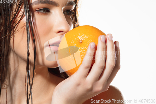 Image of Close up of beautiful female face with organic treatment over white background. Cosmetics and makeup, natural and eco treatment, skin care.