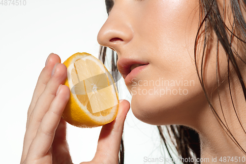 Image of Close up of beautiful female face with organic treatment over white background. Cosmetics and makeup, natural and eco treatment, skin care.