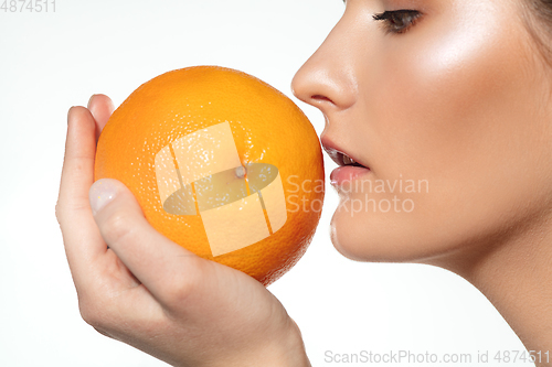 Image of Close up of beautiful female face with organic treatment over white background. Cosmetics and makeup, natural and eco treatment, skin care.