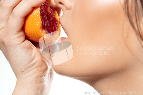 Image of Close up of beautiful female face with organic treatment over white background. Cosmetics and makeup, natural and eco treatment, skin care.