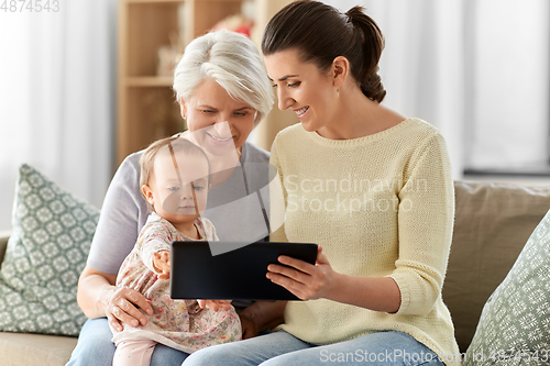 Image of mother, daughter and grandma with tablet pc